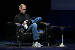 The album art for this was boring, so here’s a photo of Steve Jobs using an iPad instead (image via Getty)